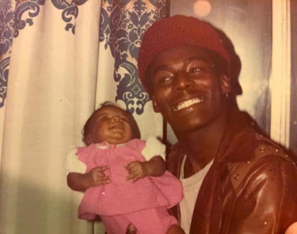 Officer Robert Venable pictured holding his niece Meredith Benson in 1973.