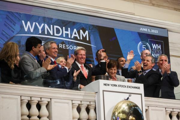 Geoffrey Ballotti, CEO of Wyndham Hotels, tings the opening bell at the New York Stock Exchange in June.