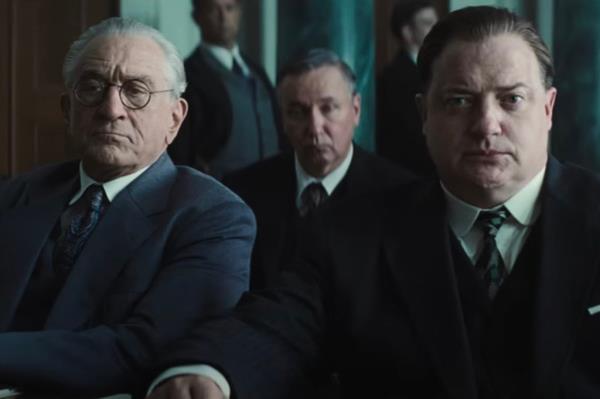 Robert De Niro and Brendan Fraser sitting next to each other looking mad. 