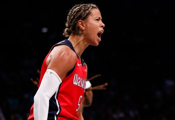 The Mystics' Natasha Cloud, who scored a career-high 33 points, lets out a yell during the Liberty's win. 