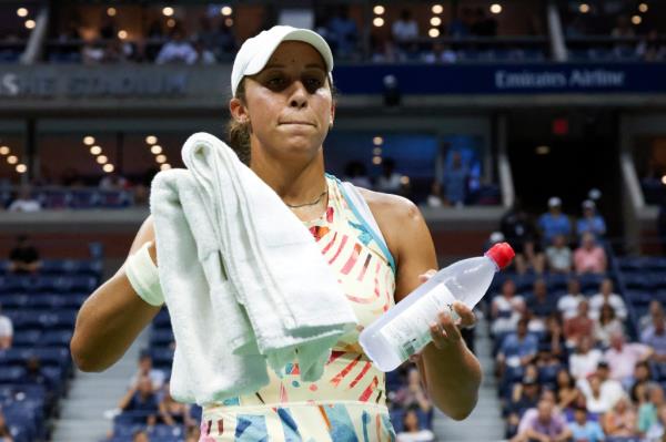 Madison Keys, of the United States, takes water and towels to a security guard for a patron that was havin<em></em>g a medical issue during Keys' quarterfinals match against Marketa Vondrousova