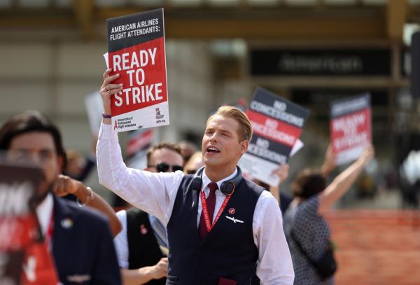 American Airlines flight attendants picket outside Ro<em></em>nald Reagan Natio<em></em>nal Airport in Arlington, Va. on Wednesday.