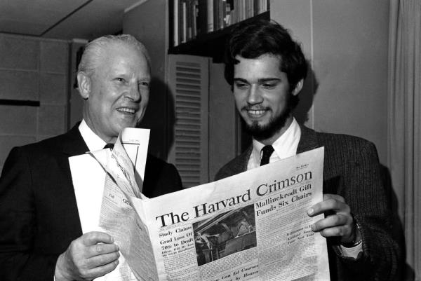 Albert Gore and Jay Burke reading the Harvard Crimson in 1968