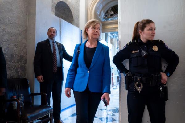 Sen. Tammy Baldwin, D-Wis., arrives as the Senate holds a procedural vote on a package of wartime funding for Ukraine, Israel and other U.S. allies, at the Capitol in Washington, Friday, Feb. 9, 2024.