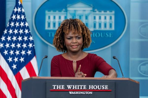 White House Press Secretary Karine Jean-Pierre speaking at a podium during a press briefing on April 15, 2024