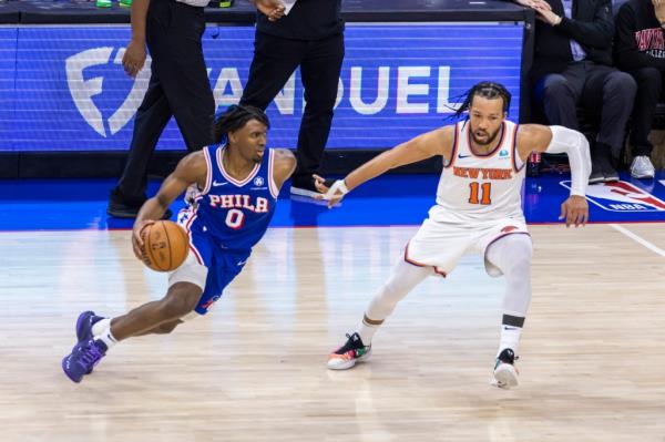 Tyrese Maxey #0 of the Philadelphia 76ers drives down court as Jalen Brunson #11 of the New York Knicks gives chase during the second half of game 3