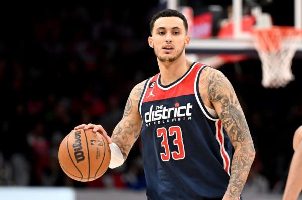 Kyle Kuzma (33) handles the ball against the Sacramento Kings at Capital One Arena on March 18, 2023 in Washington, DC. 