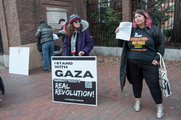 Protesters are pictured outside McKean Gate, handing out flyers.