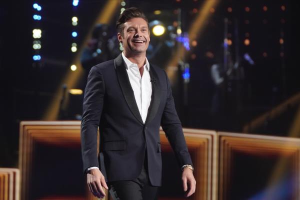 Photo of Ryan Seacrest in a suit. 