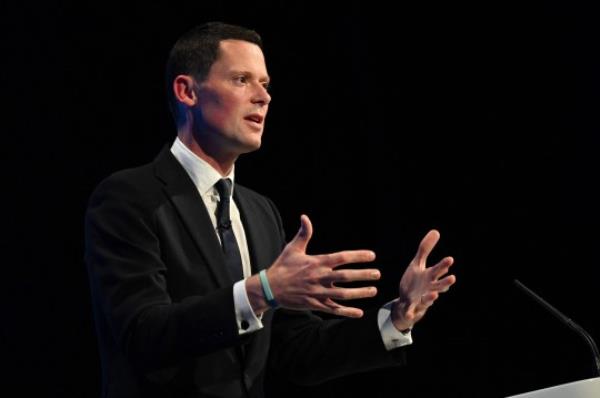 Britain's Justice Secretary Alex Chalk addresses delegates at the annual Co<em></em>nservative Party Co<em></em>nference in Manchester, northern England, on October 3, 2023. (Photo by Oli SCARFF / AFP) (Photo by OLI SCARFF/AFP via Getty Images)