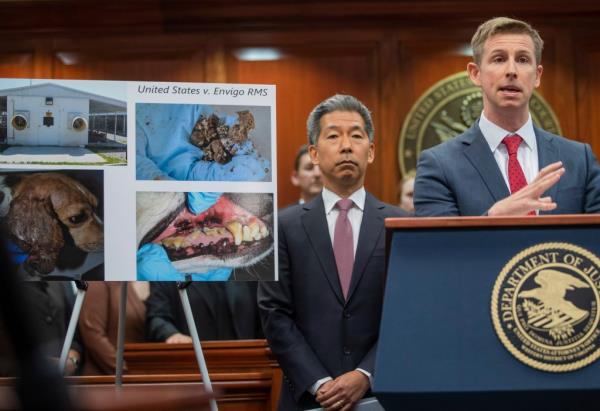 U.S. Attorney Christopher R. Kavanaugh speaking at a podium during a press co<em></em>nference at the Federal Courthouse in Charlottesville, Va. regarding a $35 million animal welfare case