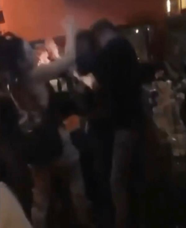 Video posted to social media captured portions of the frenzy as multiple people are caught throwing punches at each other inside the popular New England restaurant.