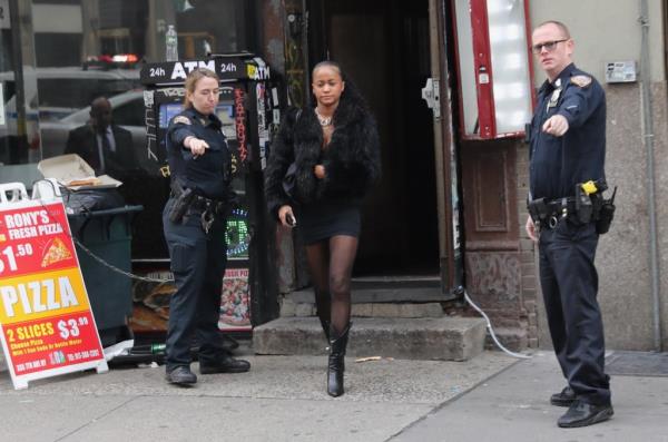 A woman leaving a crime scene at 355 7th Avenue in Manhattan