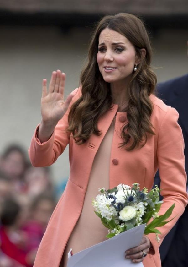 Kate suits peachy colours and loves a chic day coat for spring (Picture: AP)