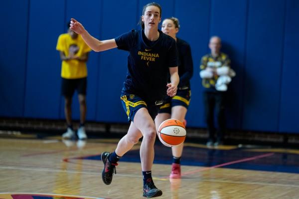 Indiana Fever guard Caitlin Clark brings the ball upcourt at her first WNBA team practice Sunday in Indianapolis.