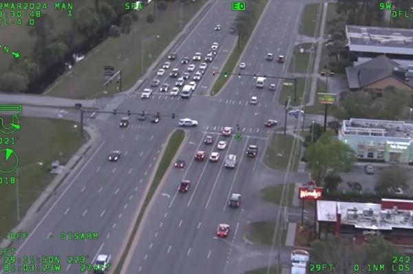 Dramatic aerial footage of the Tuesday incident shows the teenage biker recklessly weaving in and out of highway traffic, blowing through red lights at crowded intersections and taunting the police officers on his tail.