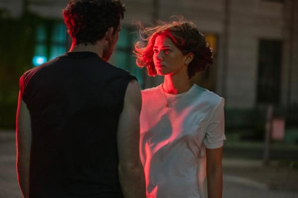 Josh O'Co<em></em>nnor and Zendaya in the 2023 film 'CHALLENGERS', looking at each other