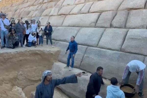 Mostafa Waziri stands outside the pyramid.