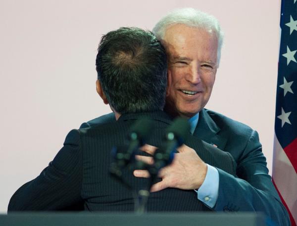 Joe Kiani is hugged by Joe Biden