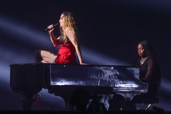 Mado<em></em>nna sings alo<em></em>ngside one of her daughter's playing the piano in rehearsal for her performcance on May 3, 2024.