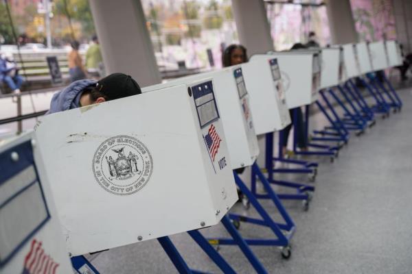 A sign for early voting is seen at the entrance to the David Rubenstein Atrium at Lincoln Center on the first day of early voting in New York, U.S., October 23, 2021. 