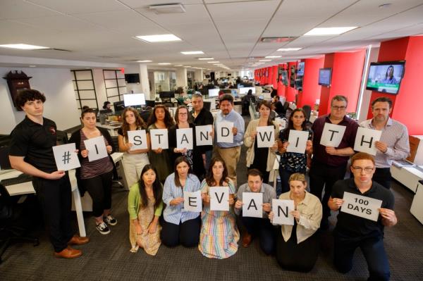 Members of the New York Post newsroom showing support for Evan Gershkovich after 100 days of detainment.