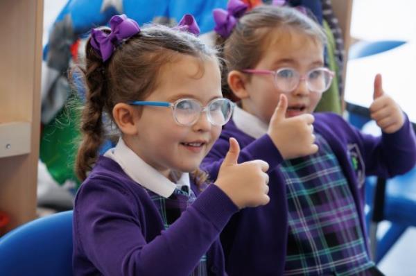 One of seventeen sets of twins due to start the new school term in the Inverclyde area pose for a photograph at St Patrick's Primary in Greenock, Inverclyde, ahead of their first day at school. Picture date: Friday August 11, 2023. PA Photo. See PA story EDUCATION Twins. Photo credit should read: Steve Welsh/PA Wire