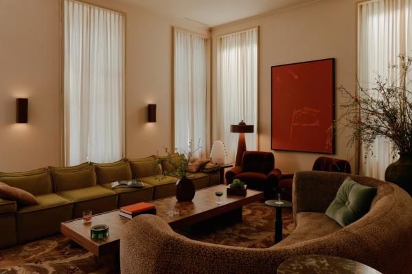 A living room with a couch and a coffee table in a hotel