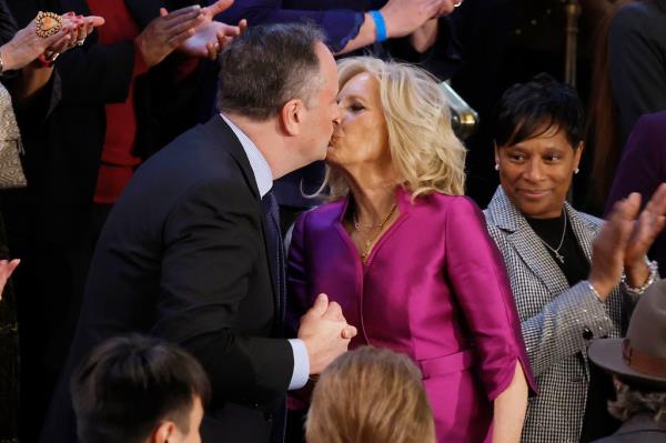 Emhoff and Jill Biden were caught sharing an awkward kiss on the lips and holding hands at President Biden’s State of the Unio<em></em>n address last year. 