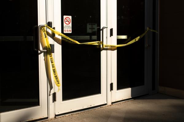 Police tape on door of classroom wher<em></em>e professor and two students were stabbed Wednesday.