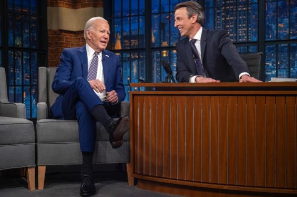 President Joe Biden speaks with host Seth Meyers during a taping of 