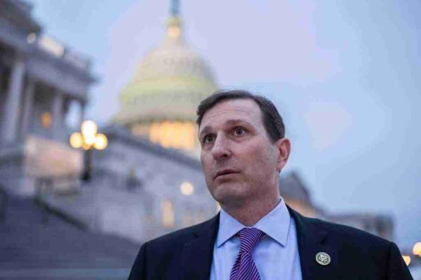 Rep. Dan Goldman, D-N.Y., talks with reporters outside the U.S. Capitol building after the House voted to keep the government funded into March.