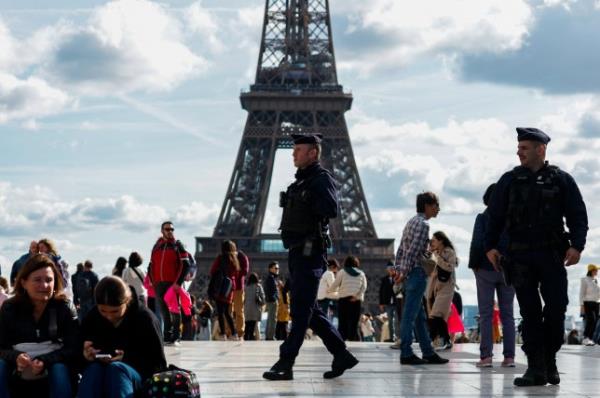 French police patrol at the Trocadero Square near the Eiffel Tower in Paris as French government puts nation on its highest state of a<em></em>lert after a deadly knife attack in northern France, October 15, 2023. REUTERS/Go<em></em>nzalo Fuentes