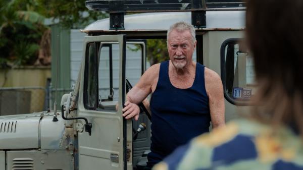 Bryan Brown as Slim Halliday in 