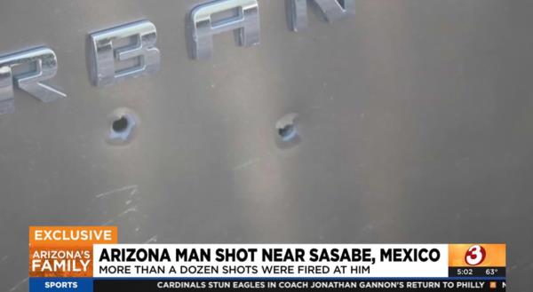 Bullet holes on the side of Ricketts's car after he got to safety away from the gang territory.