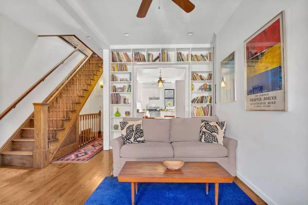 The formal living area with built-in bookshelves. 