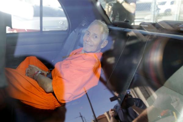 Robert Durst in the backseat of a cop car