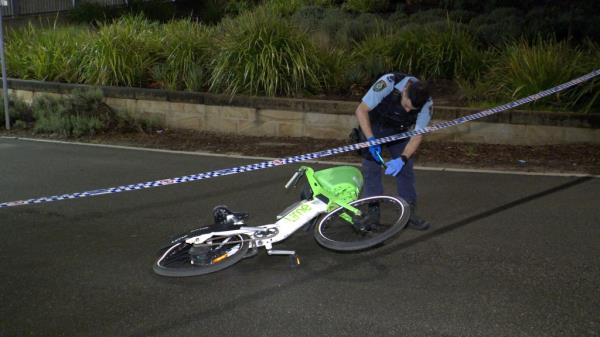 a man in serious co<em></em>ndition lying on the road next to a damaged bicycle, after being hit by a drunk driver in Sydney, Australia