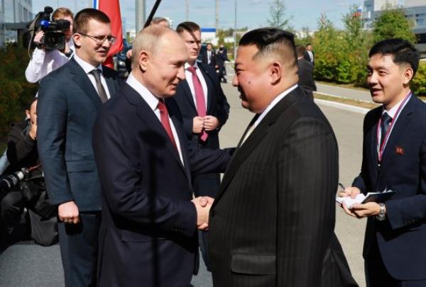 Russian President Vladimir Putin, left, and North Korea's leader Kim Jong Un shake hands during their meeting at the Vostochny cosmodrome outside the city of Tsiolkovsky, a<em></em>bout 200 kilometers (125 miles) from the city of Blagoveshchensk in the far eastern Amur region, Russia, on Wednesday, Sept. 13, 2023. (Vladimir Smirnov, Sputnik, Kremlin Pool Photo via AP)