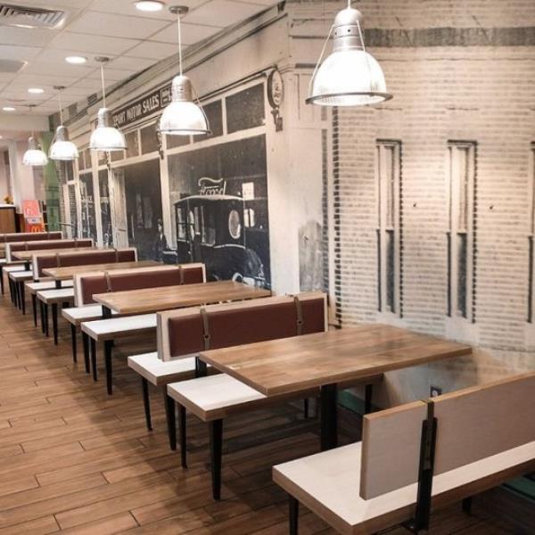 Wooden benches and a mural of old Ford cars inside the posh McDonalds.