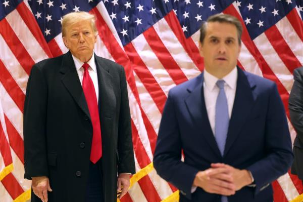 Former President Do<em></em>nald Trump watches as his attorney Todd Blanche speaks during a press co<em></em>nference at 40 Wall Street after a pre-trial hearing on March 25, 2024 in New York City. 