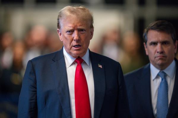 Former U.S. President Do<em></em>nald Trump in a suit and tie attending trial at Manhattan Criminal Court on May 28th, 2024 in New York City. Photo by Steven Hirsch.