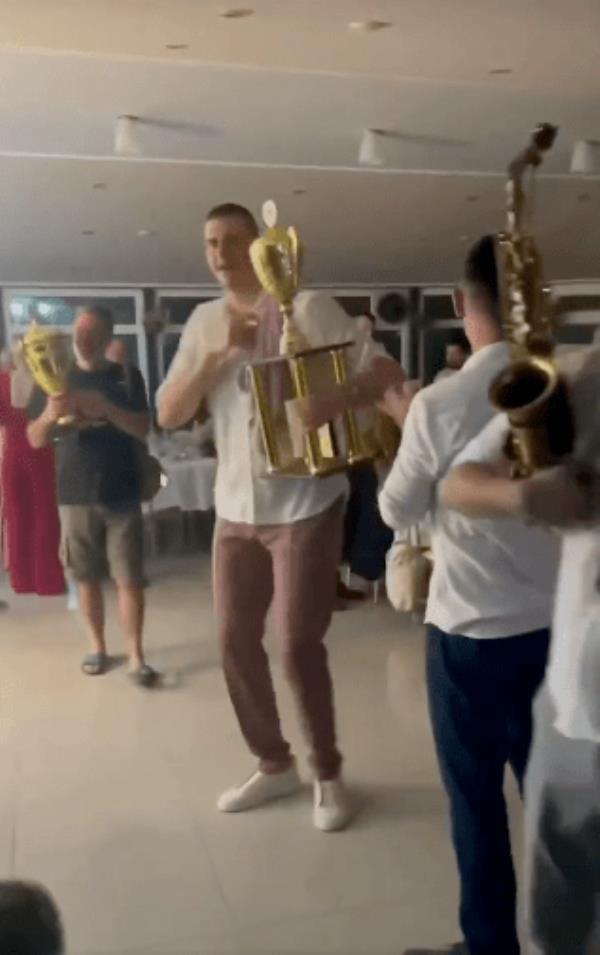 jokic dancing with trophy