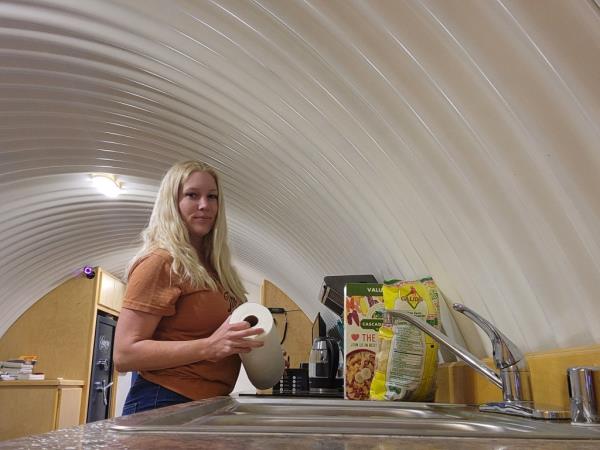 Caitlin inside the bunker, which she says offers some perks beyond saving money.