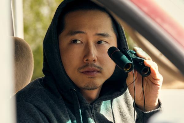 Steven Yeun looking serious. 