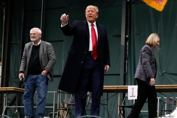 Republican presidential candidate former President Do<em></em>nald Trump gestures after speaking at a caucus site at Horizon Events Center, in Clive, Iowa, Monday.