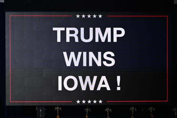 A sign announcing the Iowa win of US President and Republican presidential hopeful Do<em></em>nald Trump is displayed at a watch party during the 2024 Iowa Republican presidential caucuses in Des Moines.