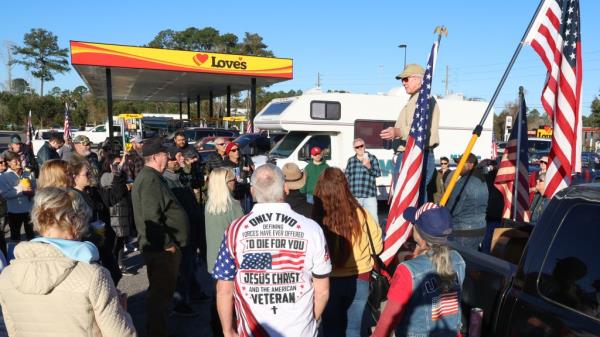 People outside a Loves gas station. 