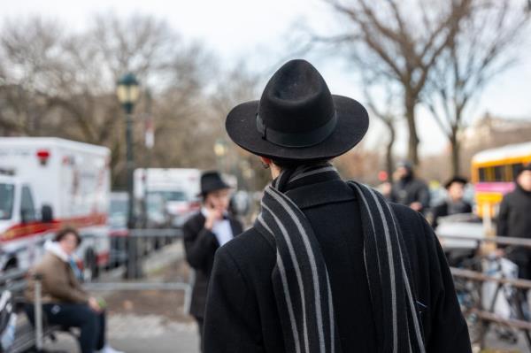 Group of Hasidic men and boys outside Chabad-Lubavitch headquarters in Brooklyn, wher<em></em>e a secret tunnel was recently discovered.