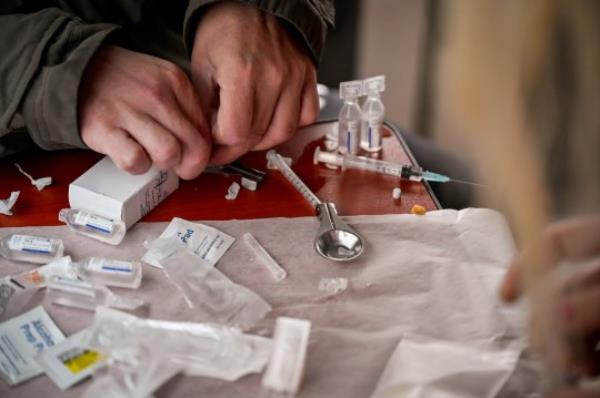 GLASGOW, SCOTLAND - SEPTEMBER 25: Drug users prepare cocaine before injecting, inside of a Safe Co<em></em>nsumption van set up by Peter Krykant on September 25, 2020 in Glasgow, Scotland. Peter a recovering heroin addict and former drugs worker, has set up the drug co<em></em>nsumption van wher<em></em>e addicts can inject safely and take drugs under supervision. (Photo by Jeff J Mitchell/Getty Images)